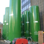 Several ATI vertical storage tanks on a construction site