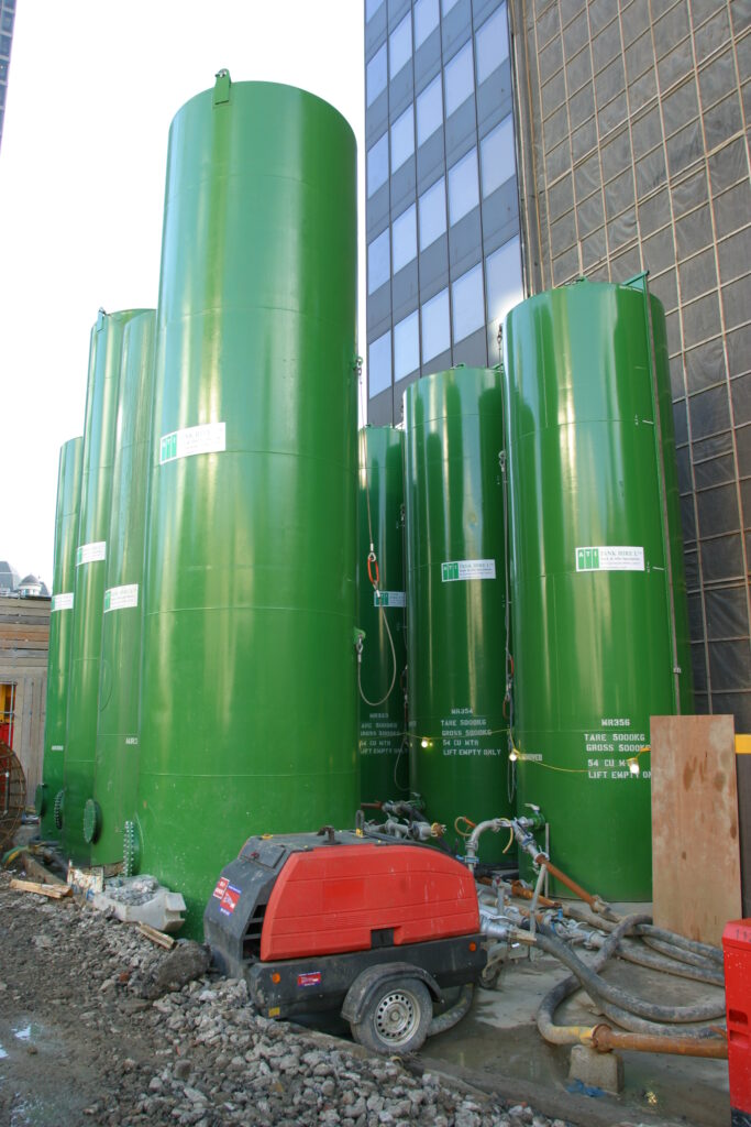 Several ATI vertical storage tanks on a construction site