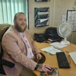 ATI's new project manager, Tony Howell sitting at his desk