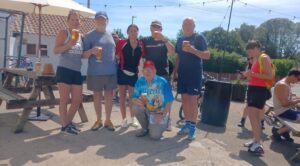 6 people standing with drinks